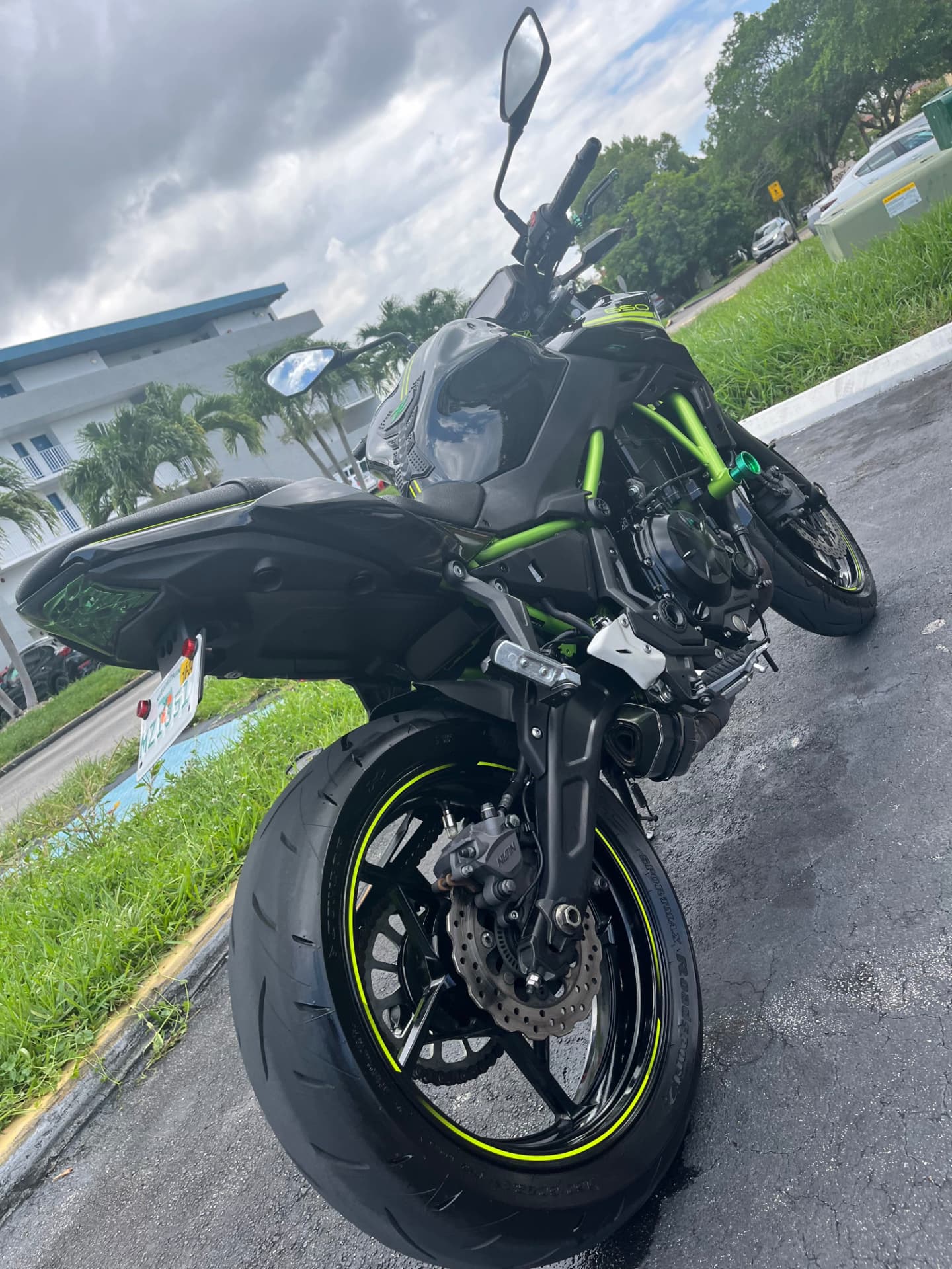 Motorcycle rear wheel, tire and frame cleaned by hand