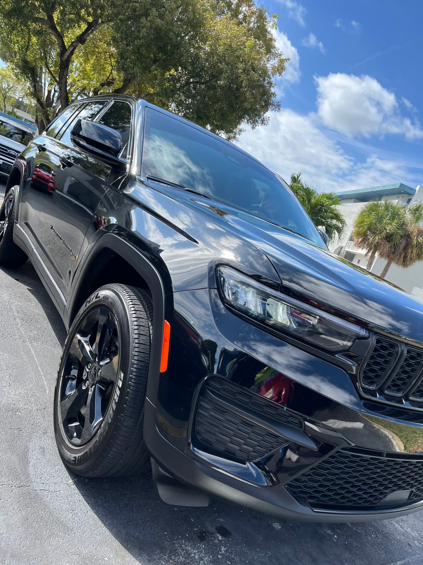 Black SUV front quarter, paint and wheel finished on site