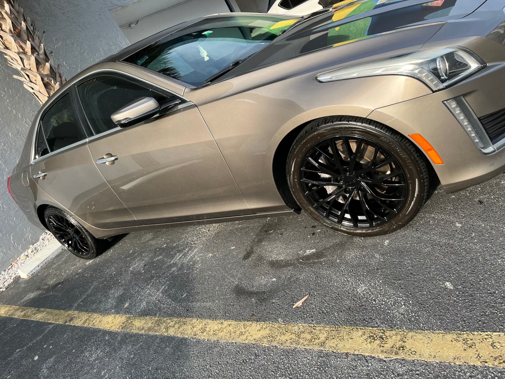 Bronze sedan side profile, wheels and paint finished on site