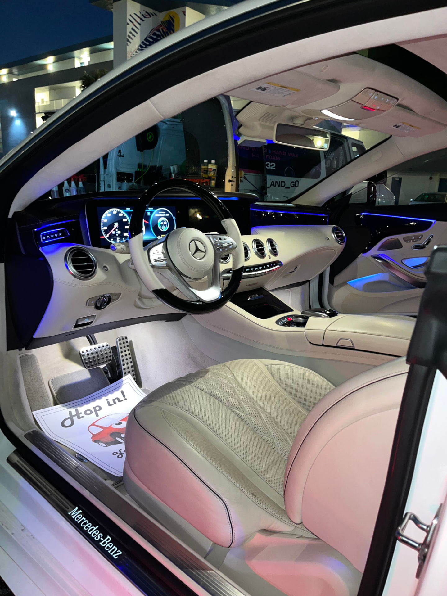 White car interior, steering wheel, dash and door sills detailed