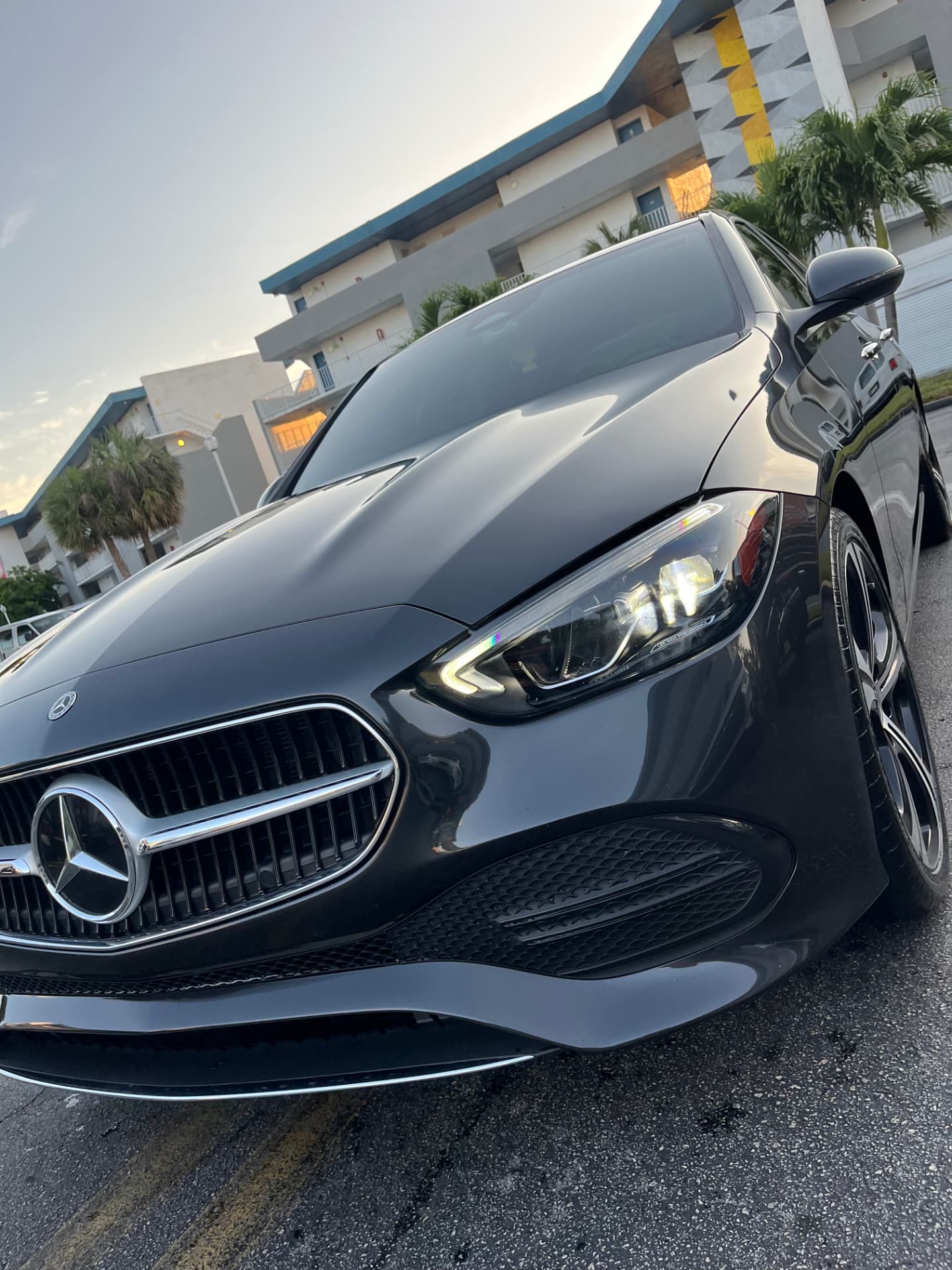 Dark grey sedan front end, grille and headlight detailed